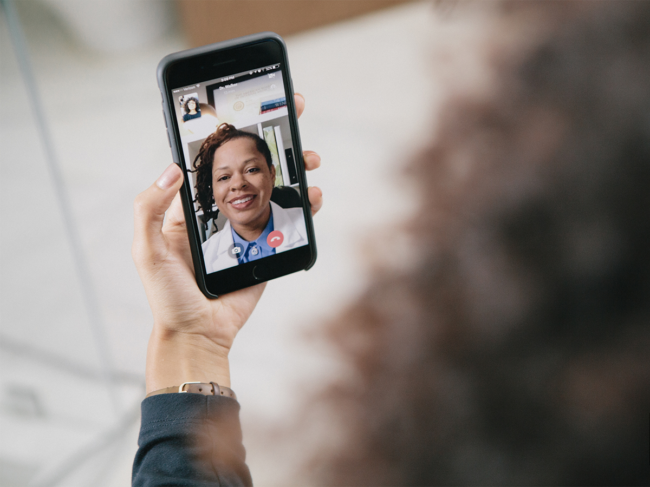 Patient video chatting with doctor on mobile phone