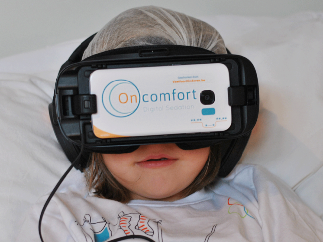 VR headset on child in hospital bed