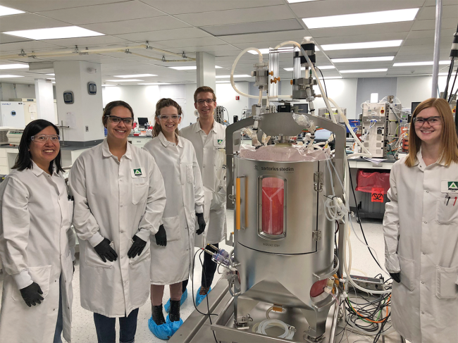 Athersys researchers with bioreactor in the lab