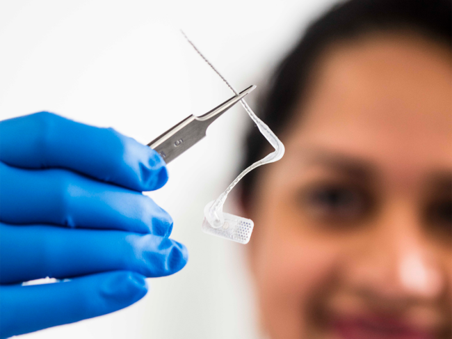 Closeup of researcher holding electrode