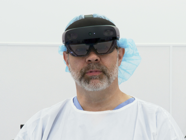 Russel Nevins wears Arthrolense's mixed reality surgical guidance system