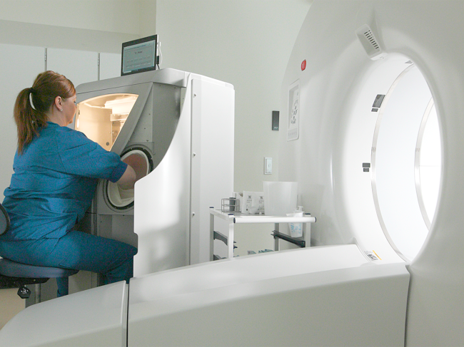 Technician operates Medtrace imaging platform