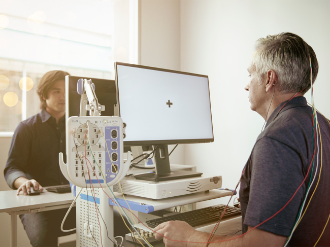 Patient undergoing cognitive testing with Champ