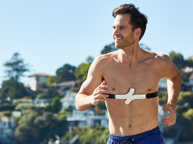 Man on jog with Qardiocore device around chest