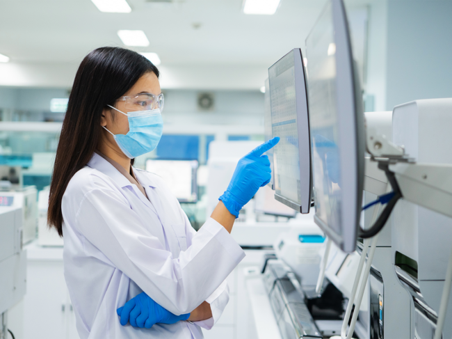 Woman working at computer in laboratory