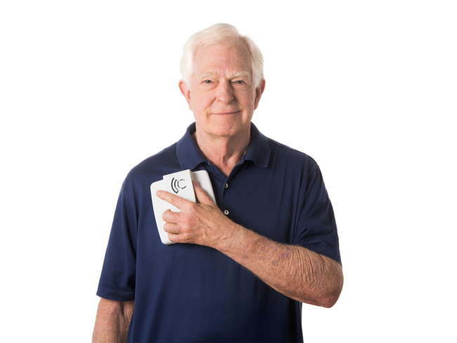 Patient holding Cordella reader over heart