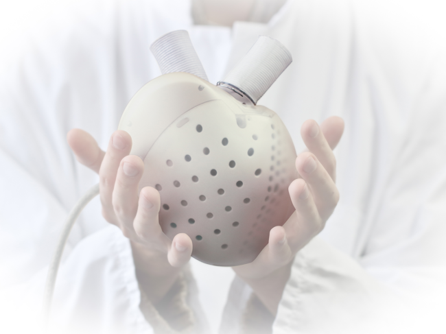 Person holding Carmat's bio-prosthetic artificial heart