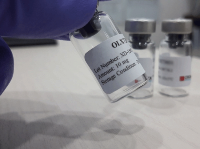 Vial of OLX-104C