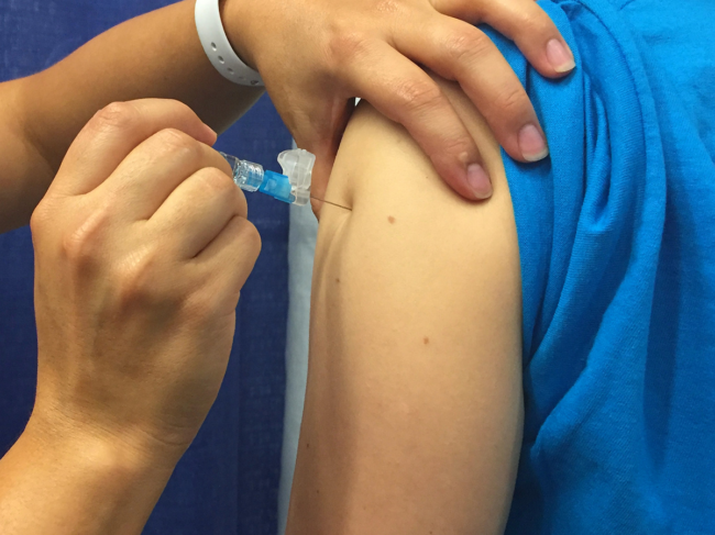 A person receives the seasonal influenza vaccine. 