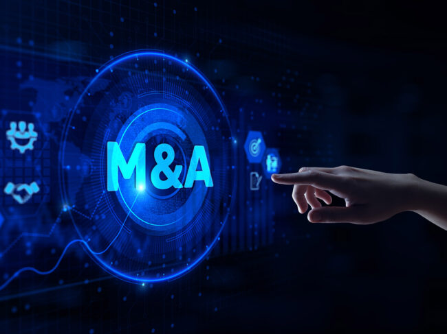 Hand pointing at digital M&A screen