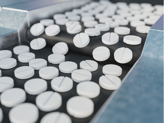 Tablets on conveyor belt