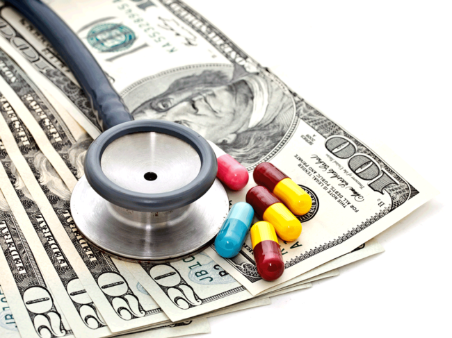 US currency, stethoscope and pills