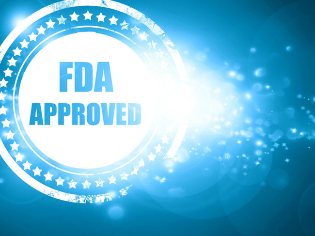 FDA approval seal on blue glittering background