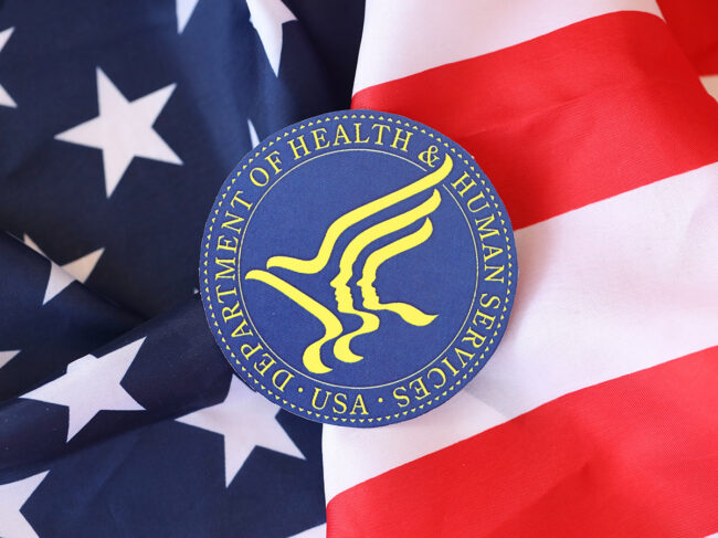 US flag and HHS logo