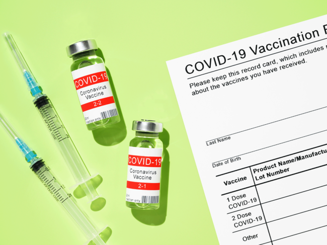 COVID-19 vial, syringe and vaccine card