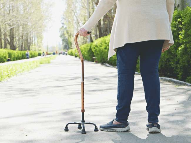 Woman walking with cane