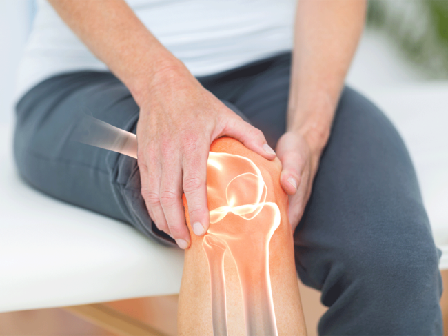 Person holding knee, joint pain