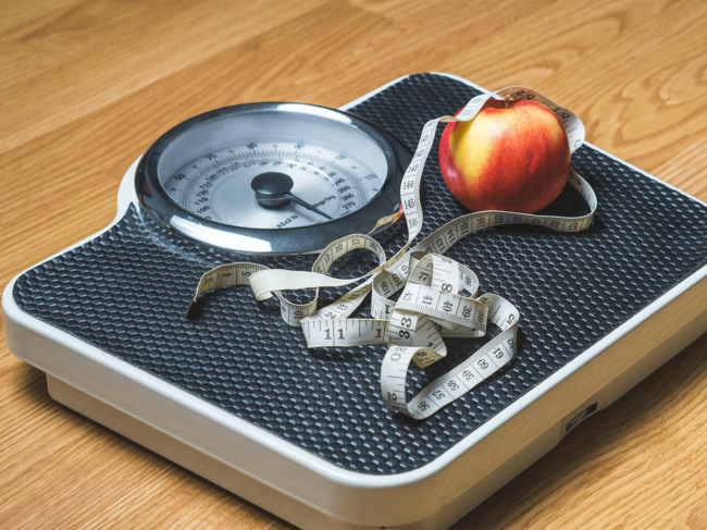 Tape measure, apple on scale