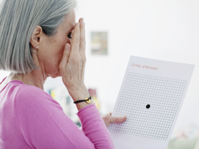 Woman taking Amsler grid eye exam