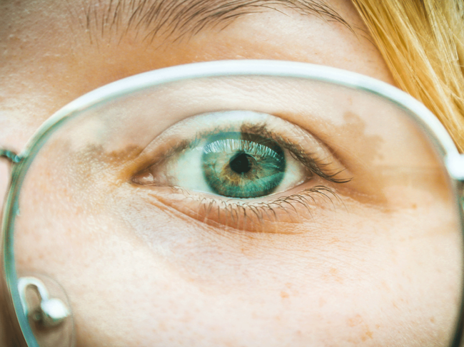 Close-up of face wearing glasses